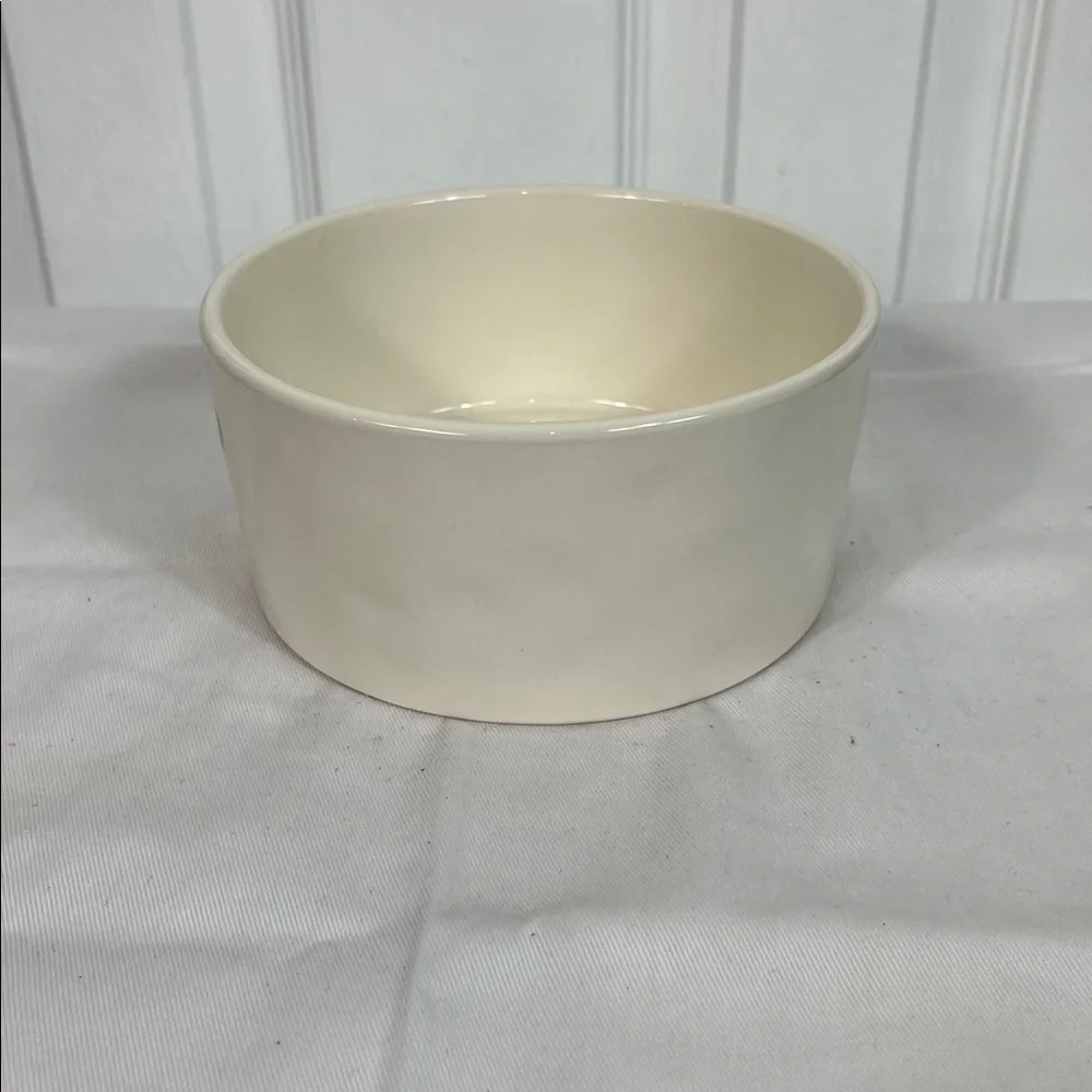 NWOT Rae Dunn white dog bowl 6”wide, 3”tall. Stick on front, WOOF inside bottom